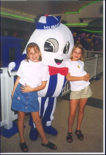 humpty mascot posing with two girls